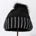 Detail of black winter knit hat featuring colorful rhinestones and faux fur pom-pom ball - Black