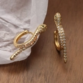 Gold-plated snake hoop earrings with clear crystals and green eyes on white texture - Snake Shape Green Eye Rhinestone Style (43628)