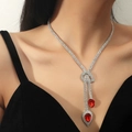 Elegant silver copper Y-necklace with vibrant red teardrop crystals worn by a model - Red Waterdrop Silver Set(DTN14027014R)