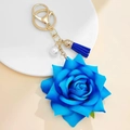 Elegant blue fabric rose keychain with gold hardware, white pearl and matching tassel charm - Blue