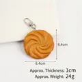 Realistic PVC cookie keychain featuring light brown swirl texture and silver lobster clasp - Yellow Spiral Cookie Lobster Clasp