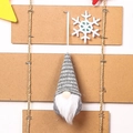 Detail of a gray knitted Christmas gnome ornament with white beard and wooden nose - Gray Type A
