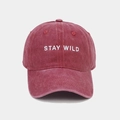 Detail of burgundy washed cotton baseball cap featuring Stay Wild white embroidery texture - Adjustable / Burgundy