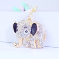 Sprankelende olifant sleutelhanger met strass steentjes en zwart emaille op goud metaal - Wit