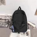 Minimalistischer großer schwarzer Nylon-Reiserucksack für Schüler mit Anhänger - Schwarz Mit Blauem Astronauten-Anhänger
