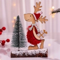 Handcrafted wooden reindeer ornament with red plush coat and mini Christmas tree on snowy base - Red Hat Red Clothes Style