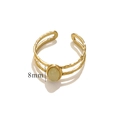 Hammered gold stainless steel open ring featuring an 8mm oval green stone inlay - Light Green / Gold Band