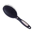 Cepillo de masaje con cojín de aire en negro y oro champán sobre fondo blanco - Peine de Paleta con Acento Dorado / Negro