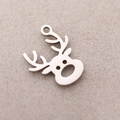 Polished silver stainless steel deer head pendant charm on beige velvet background - DY832-1 Steel Color Reindeer Head