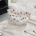 Detailed flat lay of a white cotton cosmetic bag with cute cartoon puppy and star prints - Star Dog