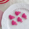 Pack of 5 hot pink heart-shaped Y2K resin hair clips for girls arranged on a white plate - Small Red Heart Clips (Set of 6)