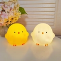 Cartoon chick night lights glowing in warm white and yellow silicone finishes - Medium Chick - Yellow