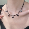 Gothic black beaded necklace with five silver-edged heart charms worn on neck - Five Heart Pendants Style / Silver