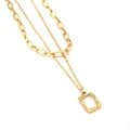 Detail of layered gold stainless steel necklace with oval links and textured pendant - Square Pendant Necklace / Gold