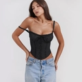Close-up of the delicate lace details and drawstring tie on this black corset top - S / Black