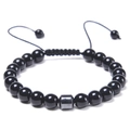 Detail of adjustable woven cord on black beaded bracelet with metallic cylinder accent - Obsidian Bracelet