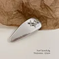 Silver teardrop hair clip with rhinestone stars and metallic finish, 7x3cm size - Waterdrop Clip