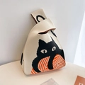 Knitted tote bag in beige with black cat pattern and orange yarn ball design - Cat with Yarn Ball