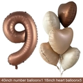 Detail of rose gold number 9 balloon and heart shaped balloons for party decor - Chocolate Number 9 / Number And Heart Balloon Combination