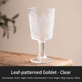 Leaf-patterned clear glass goblet with vintage relief, 300ml capacity on wood table - Clear White
