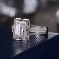 Luxurious white gold ring with rectangle cut zircon and micro-pave setting on blue texture - US 10 / Silver