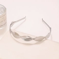 Detail shot of silver metal leaf headband on a minimalist display with a candle - Solid Leaf Style (3#) / Silver