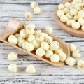 Realistic PVC lotus seeds model displayed on a wooden spoon for food photography props - Colored Lotus Seeds (500g)