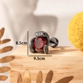 Titanium steel stud earring with red zircon and black claw setting on a wooden stand - Black Red (Single)