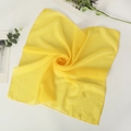 Vibrant yellow chiffon square scarf with smooth silk texture and natural drape for styling - Yellow