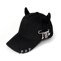 Detail of black punk baseball cap featuring silver metal rings and heavy pendant charms - Safety Pin Tools Black