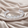 Silver stainless steel open bangle with hammered clover patterns on silk background - f33 Clover Hammered Style / Silver