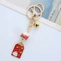 Portachiavi giapponese Maneki Neko con ciondoli portafortuna e campanello d'oro - Gatto della Fortuna Rosso