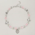 Close-up of pink heart beads and silver butterfly charms on Y2K pearl necklace - Vintage Tulip Style