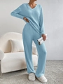 Detail of light blue ribbed knit loungewear set featuring V-neck top and wide pants - XS / Blue