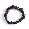 Handmade elastic bracelet featuring natural black irregular stone chips on white background - Black Tourmaline