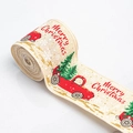 Detail of Christmas burlap ribbon roll featuring red truck, tree, and snowflake patterns - Beige Car Truck
