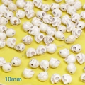 Close-up of 10mm skull-shaped white turquoise beads for DIY jewelry making and crafts - Large Skull (10mm)