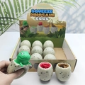 Squeeze dinosaur eggs toy in display box, green and red small dinosaurs popping out - Grey Shell Dinosaur Egg Squeeze Toy