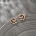 Rose gold spiral stud earrings featuring white cubic zirconia and a teardrop stone - Rose Gold Spiral Waterdrop Pave / Rose Gold