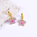 Golden butterfly drop earrings with purple floral enamel patterns on a white marble background - Earrings