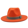 Detail of bright orange wool fedora hat featuring a black and white striped woven band - Orange