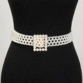 Detail of elegant multi-row pearl woven belt with square pearl buckle on a black mannequin - Seven-row Pearl Square Buckle Belt Gold