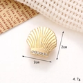 Golden shell shoe charm accessory featuring white crystals on a textured fabric background - C248 Gold Rhinestone Shell