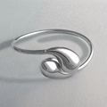 Macro view of polished silver water drop detail on a minimalist open stainless steel bangle - Teardrop Shape (Silver) / Adjustable