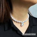 Baroque pearl necklace with 35+5cm adjustable chain shown on a black shirt - Irregular Pearl Drop 35+5cm