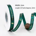 Dark green satin ribbon with gold Merry Christmas print and bell icons for decor - 1.0cm Dark Green Merry Christmas Ribbon with Bells 25 Yards