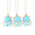 Macro detail of three scarab pendants with evil eye inlay on turquoise stone - Synthetic Turquoise (No Chain)