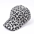 Detail shot of the plush leopard print baseball cap fabric and sturdy visor structure - Black Leopard