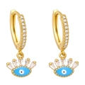Detailed view of gold evil eye earrings featuring blue enamel and sparkling zircon stones - Light Blue