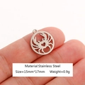 Hand holding a hollow crab pendant made of stainless steel with dimensions and weight - Crab-DY1082-1